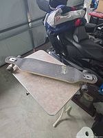 Full view of Sector 9 longboard on table