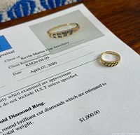 ring and appraisal sheet showing photo of ring, appraisal details visible