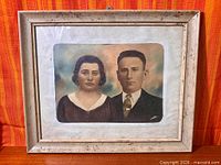 Full view of framed photograph showing entire item and frame condition