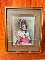 Full view of framed watercolour showing subject and cracked glass