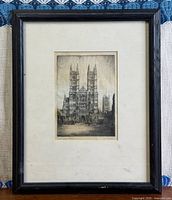 Full view of framed etching showing frame, mat, and artwork