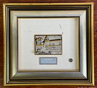 Front view of framed ORART silver relief plaque with visible church scene and frame styling