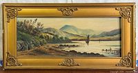 Full view of framed coastal oil painting