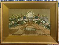 Full view of framed embroidery showing artwork, mat and frame