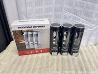 Retail box showing product image and label 'Touch Soap Dispenser'