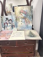 All five canvas prints displayed on dresser