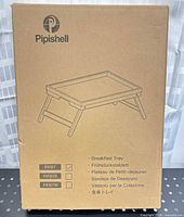 Front of sealed Pipishell retail box showing bamboo breakfast tray illustration