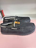 Side profile of both slippers showing overall design and outsole