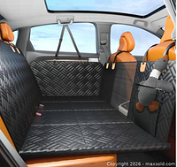 Stock image of the PROZAR hard-bottom dog car seat cover installed on a car’s back seat.