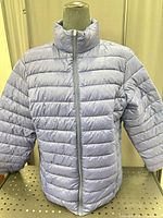 Front view of light blue puffer coat on mannequin