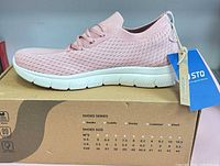 Left side view of STQ pink mesh sneaker on box showing overall style and sole