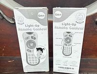 Front view of both sealed Bambiya light-up remote control boxes
