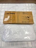 Boxed and bagged Swaycy ear pillows on table