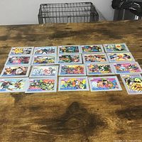 All 20 trading cards laid out on table