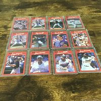 All twelve cards arranged 3×4 in sleeves