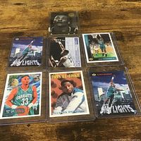 All six Alonzo Mourning cards in rigid sleeves