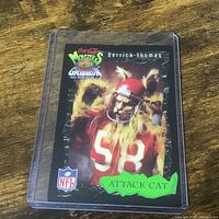 Front of Derrich Thomas Monsters of the Gridiron card in plastic sleeve