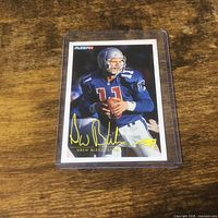 Front view of card inside plastic holder showing action photo, facsimile signature and Fleer94 branding