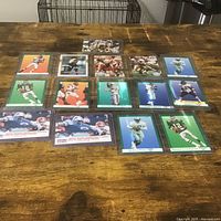 Group shot of all trading cards laid out in sleeves