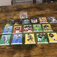 All 17 football trading cards laid out on table
