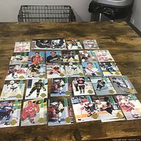 All 27 hockey cards laid out on table