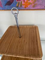Top tier square bamboo shelf with chrome ring handle