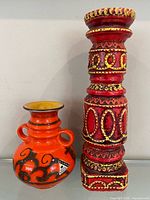 Front view showing both vase and candlestick
