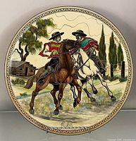 Front view of entire plate showing painted scene and rim design