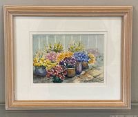 Front view of framed watercolour painting of flowers
