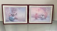 Both framed floral prints side by side