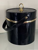 Front view of black patent leather ice bucket