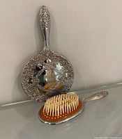 Full view of mirror back and brush bristles