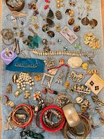Full layout of assorted jewellery pieces on towel