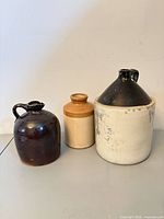 All three stoneware vessels grouped together
