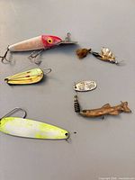 Overview of six assorted lures on tabletop