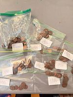 All nine bags of pennies labeled by year 1980-1989