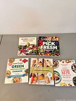 Front view of all five cookbooks