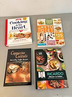 Group shot of all four cookbooks front covers visible