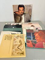 Group shot of all records spread on table showing front covers