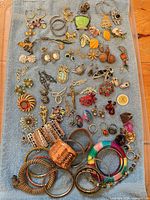 Full layout of entire jewellery assortment on blue towel