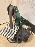 Overall view of Central Machinery belt sander showing work table and belt arm