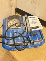Tile saw with cord, guide, blades package and manual