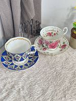 Overall view of both teacup and saucer sets