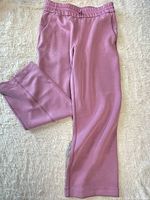 Front view of mauve straight-leg sweatpants laid flat