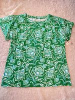 Front view of green and blue floral Talbots shirt with tags