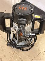 Top and side view of the Toupie 150 router showing handles, motor housing and cord