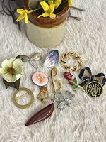 Group shot of all 12 brooches