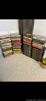 Three stacks of cassette tapes showing quantity and variety