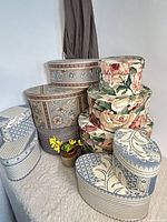 Group of seven fabric nesting boxes in three patterns