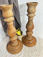 Both maple candlesticks standing side by side